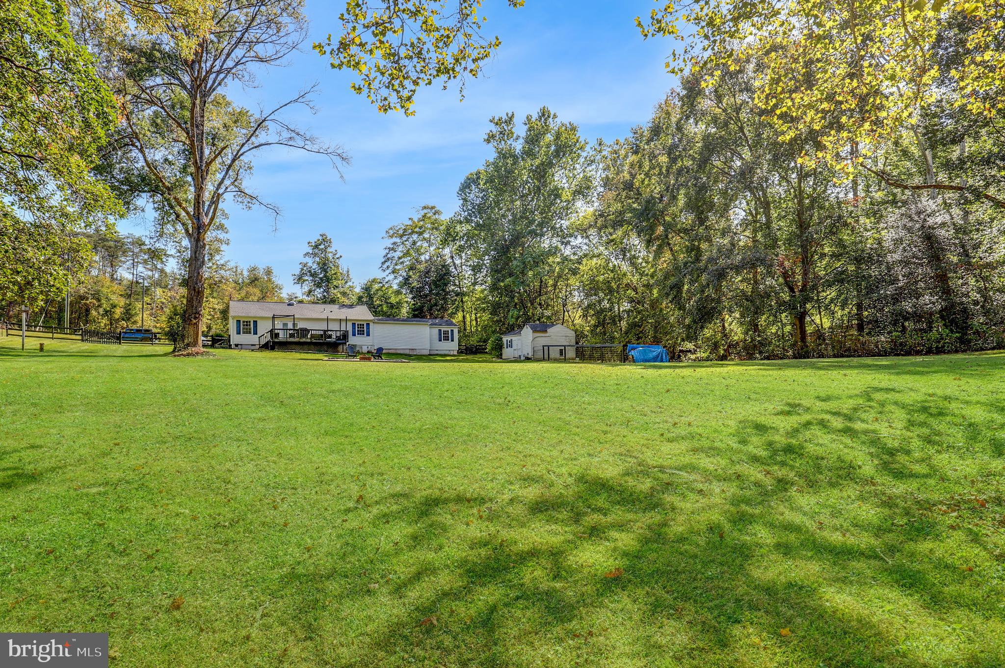 9422 Brentsville Road Manassas, VA 20112 - Photo 35 of 37 a view of yard with trees and grass