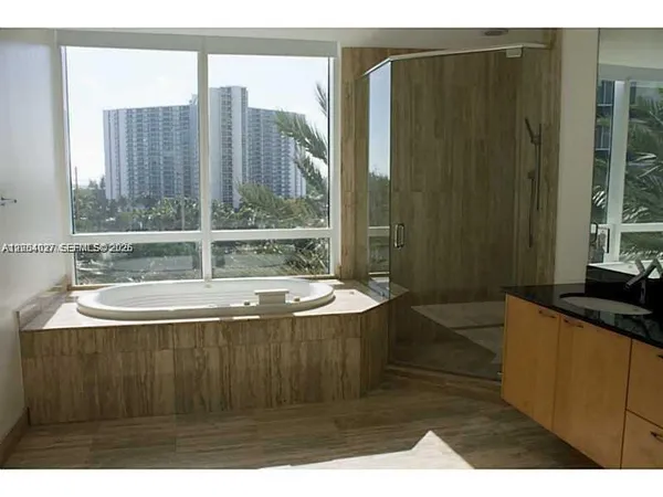 a view of bath tub sitting next to a window