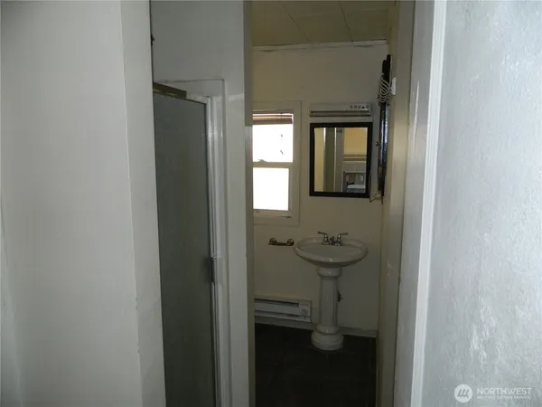 a bathroom with a sink and mirror