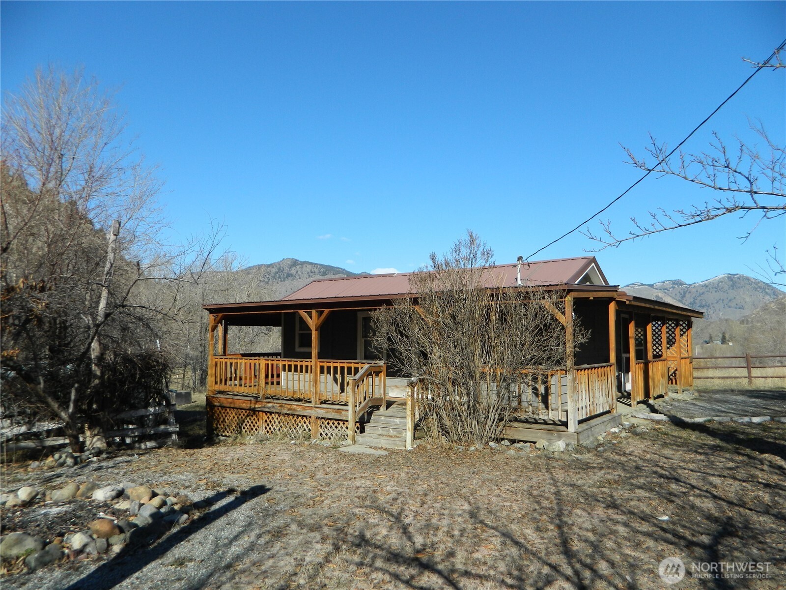 2127 Sinlahekin Road Loomis, WA 98827 - Photo 2 of 16 a view of a outdoor space with a patio