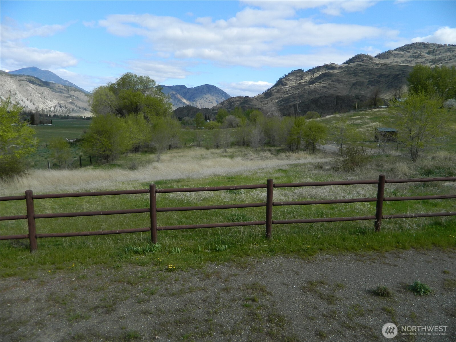 2127 Sinlahekin Road Loomis, WA 98827 - Photo 22 of 24 a view of a yard with wooden fence