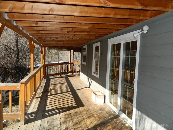 a view of balcony with wooden floor
