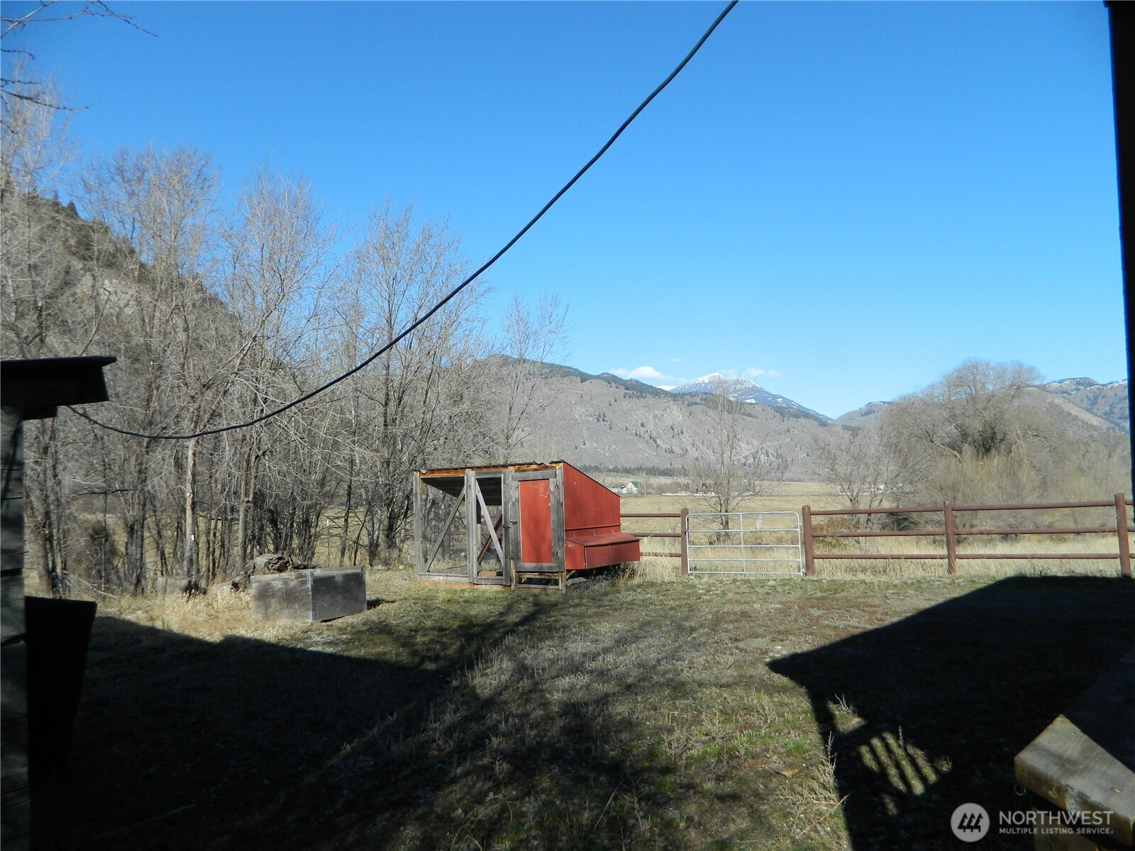 2127 Sinlahekin Road Loomis, WA 98827 - Photo 7 of 16 a view of a lake with a mountain in the background