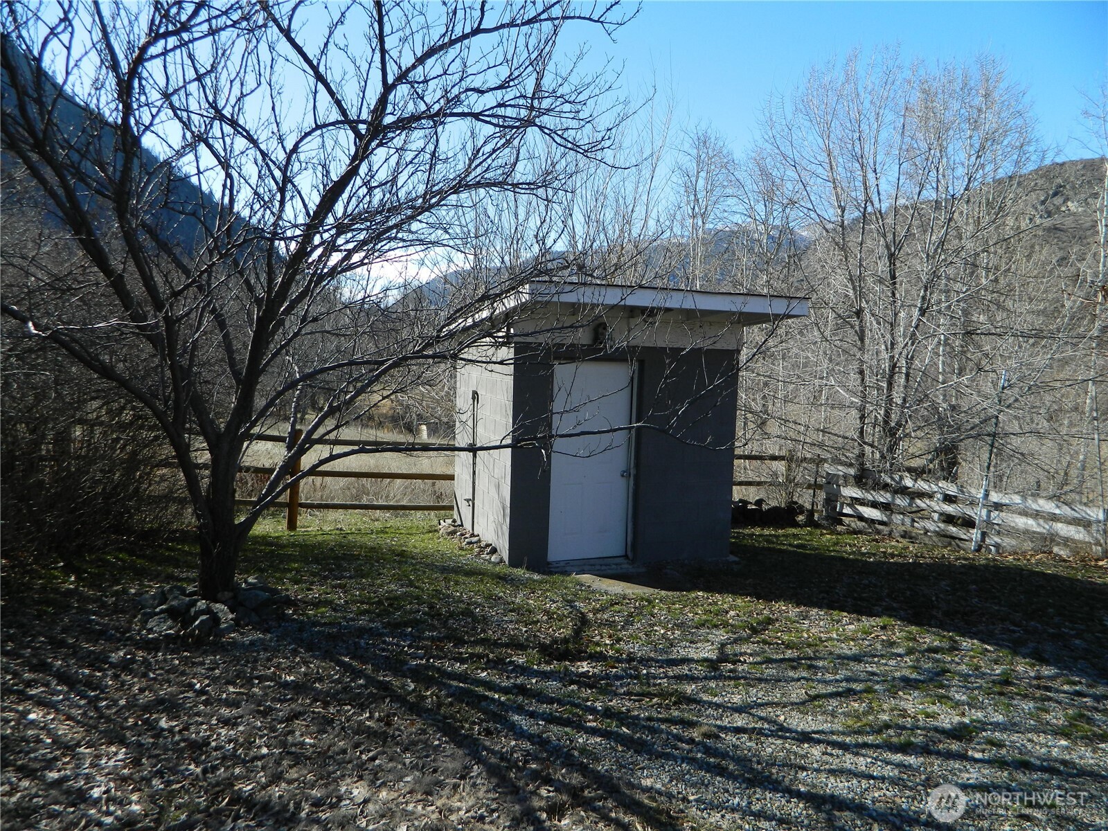 2127 Sinlahekin Road Loomis, WA 98827 - Photo 9 of 16 a front view of a house with a yard