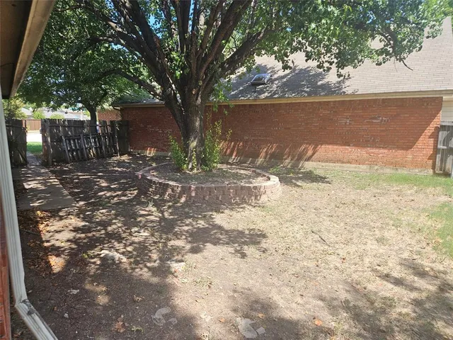 a swimming pool with outdoor seating and yard