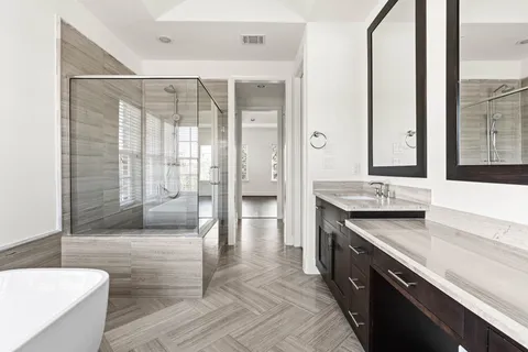 a kitchen with granite countertop a sink a counter top space and stainless steel appliances