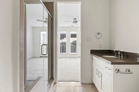 a view of a bathroom with white walls