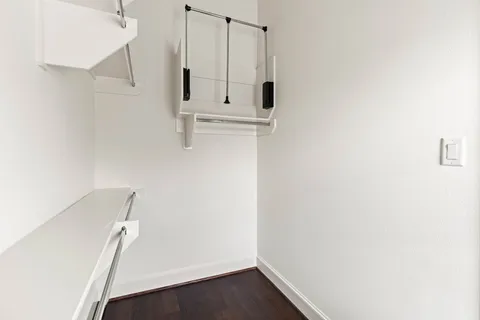 a bedroom with bed couch and window