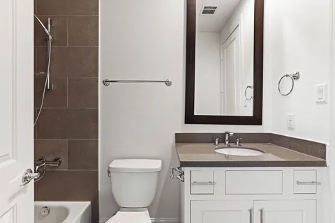 a view of a hallway with washer and dryer