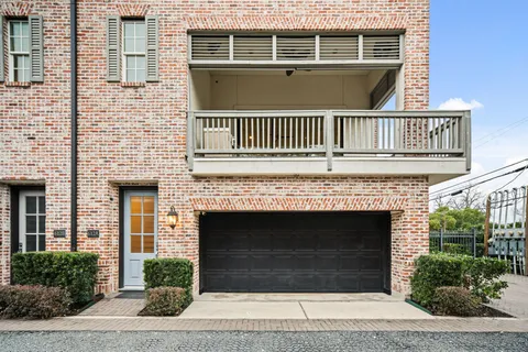 a front view of a house with a grill
