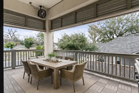 a view of a chair and table in the balcony