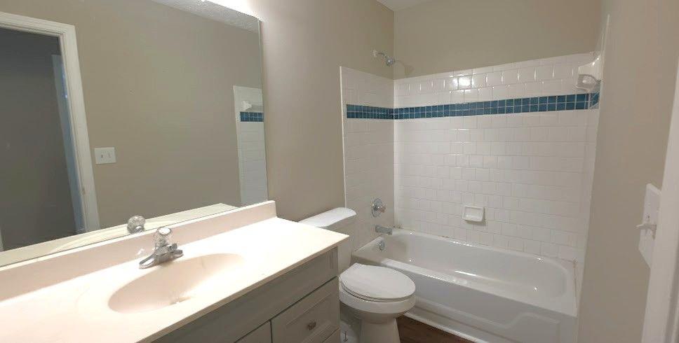 984 Pointers Way Lawrenceville, GA 30043 - Photo 10 of 20 a bathroom with a sink toilet and shower