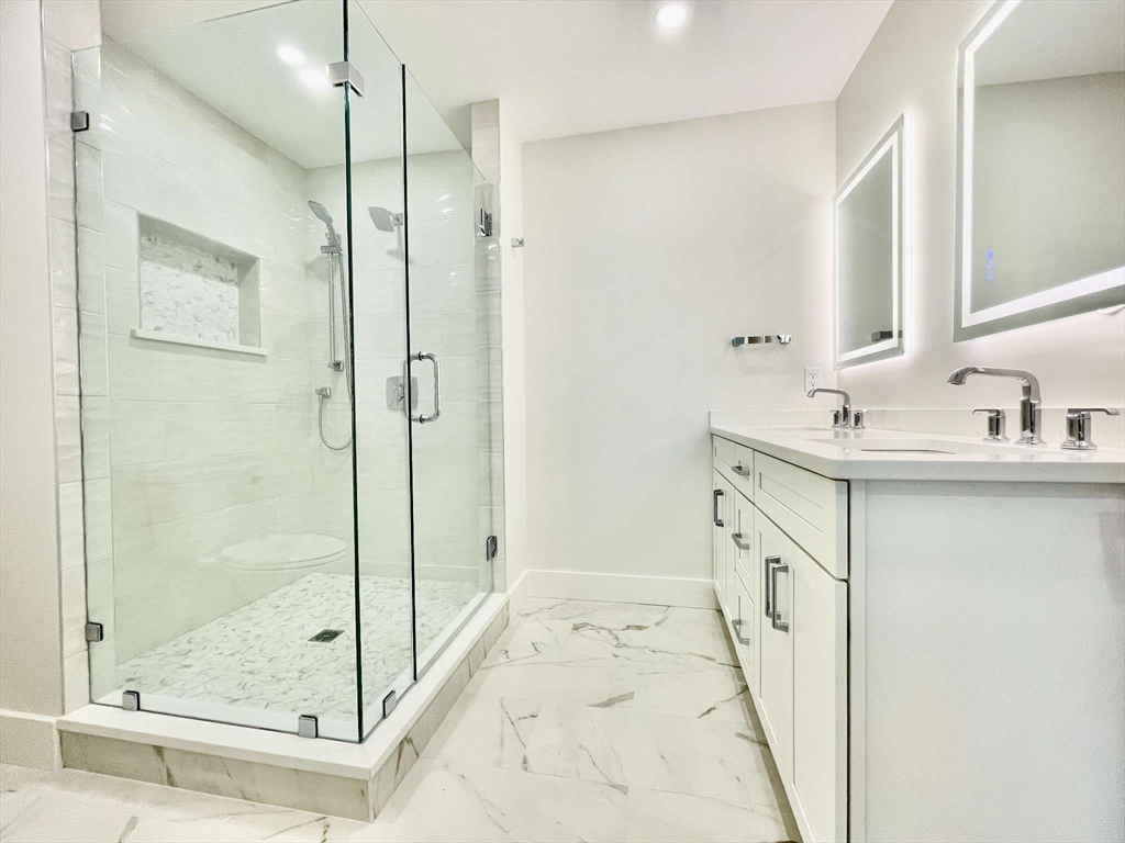 75 Neponset Street, Unit 5 Canton, MA 02021 - Photo 14 of 27 a bathroom with a sink and a mirror