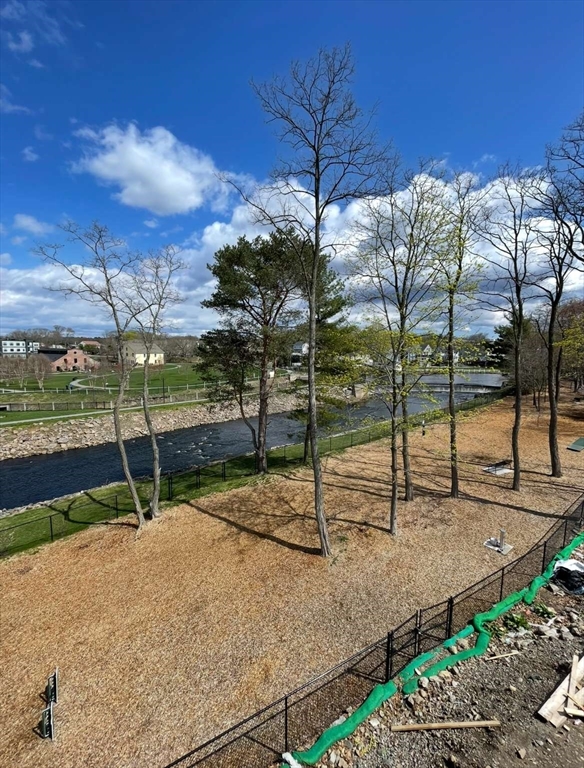 75 Neponset Street, Unit 5 Canton, MA 02021 - Photo 23 of 27 a small garden with trees in the background
