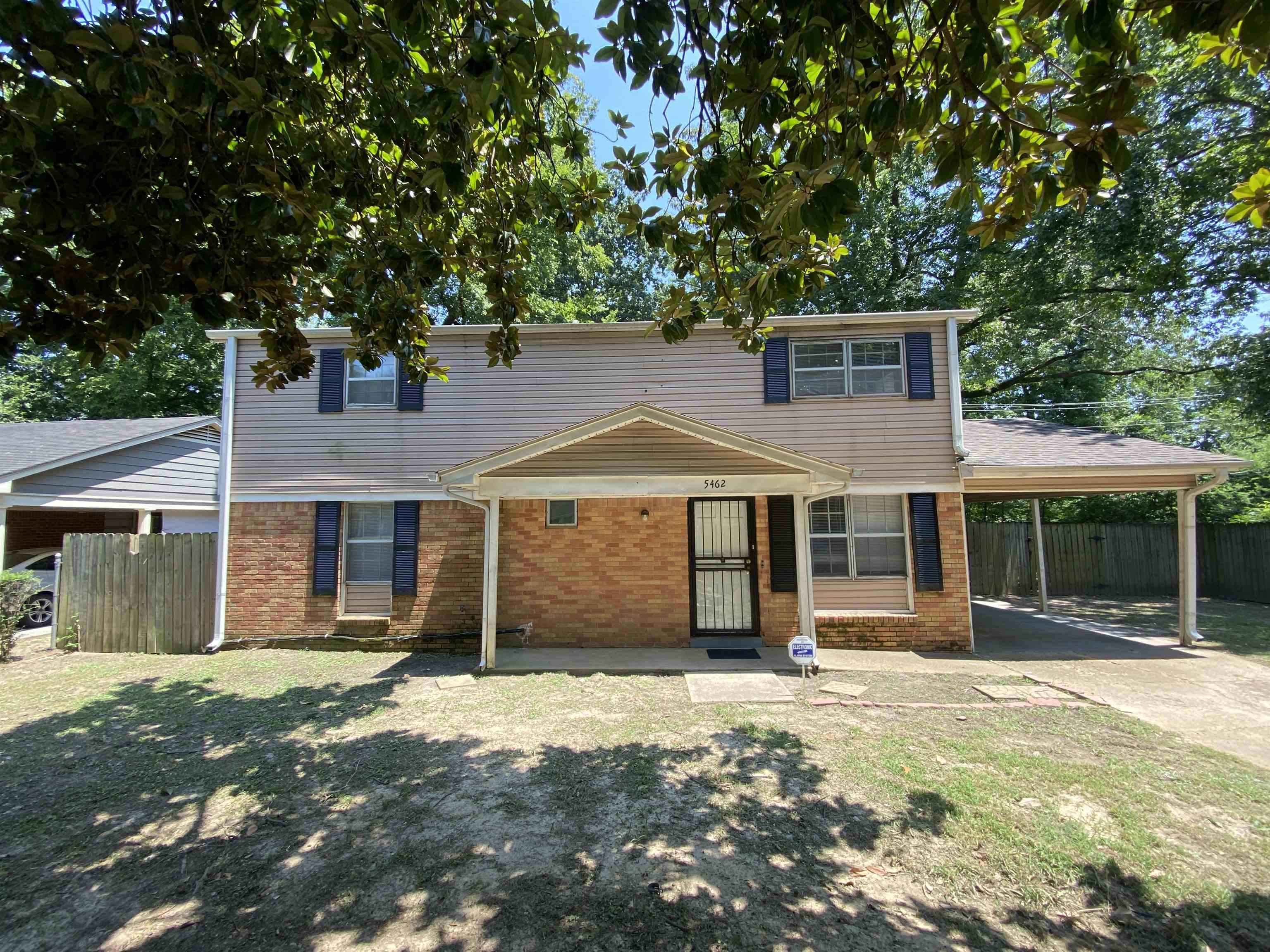 front view of a house with a yard