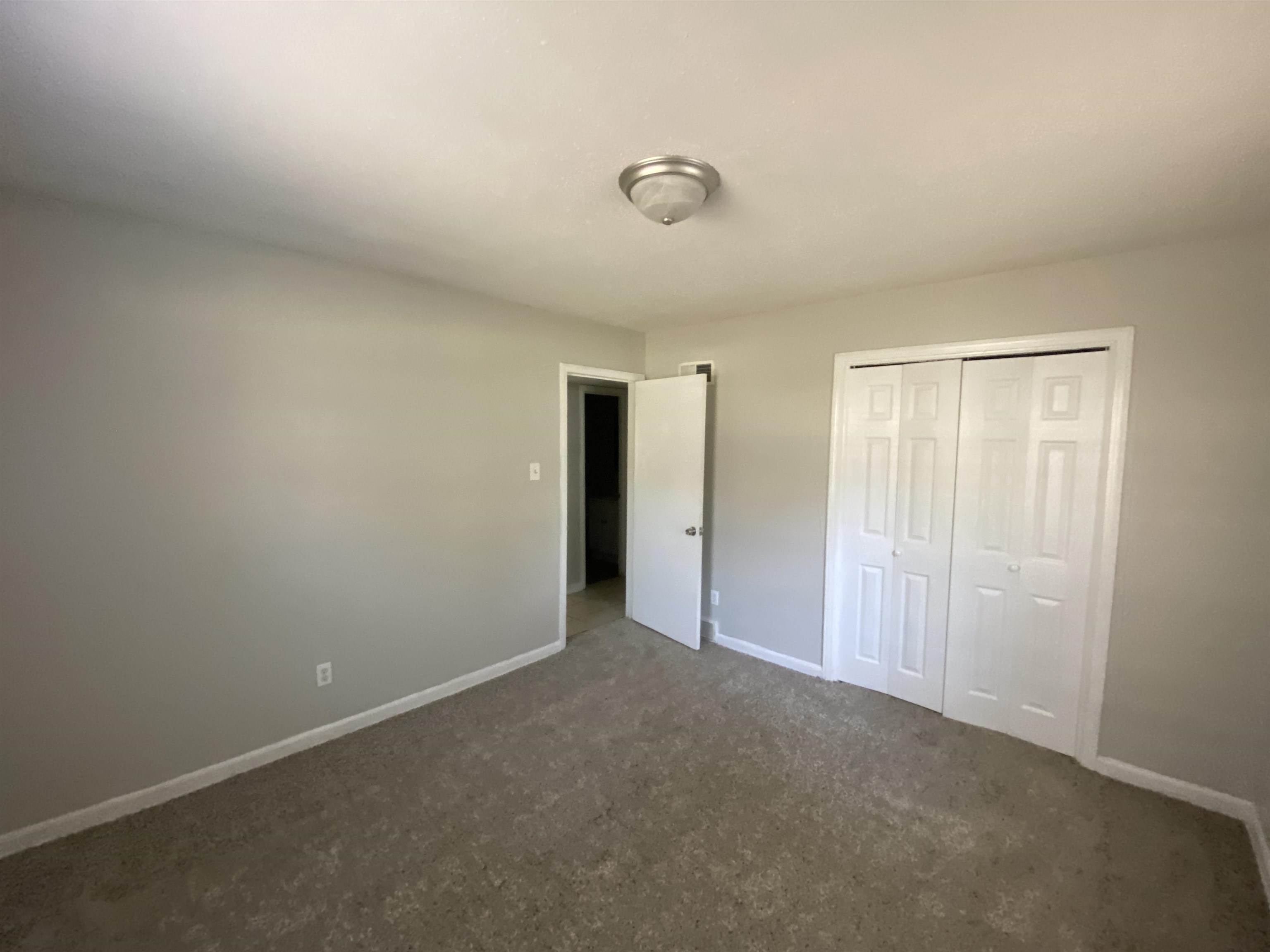 5462 Haleville Road Memphis, TN 38116 - Photo 4 of 7 a view of an empty room and closet area