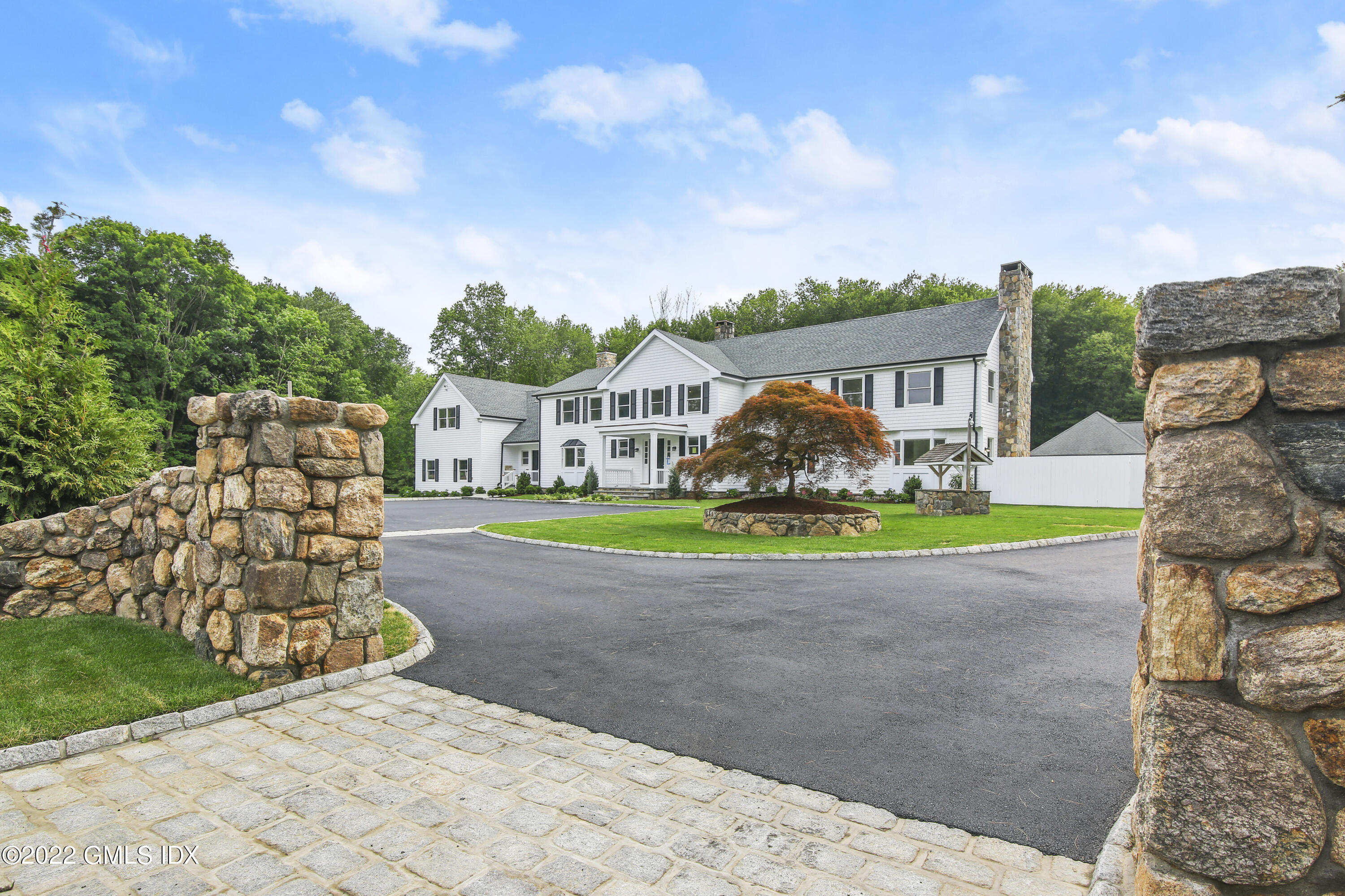 433 Stanwich Road Greenwich, CT 06830 - Photo 1 of 37 a front view of a house with garden