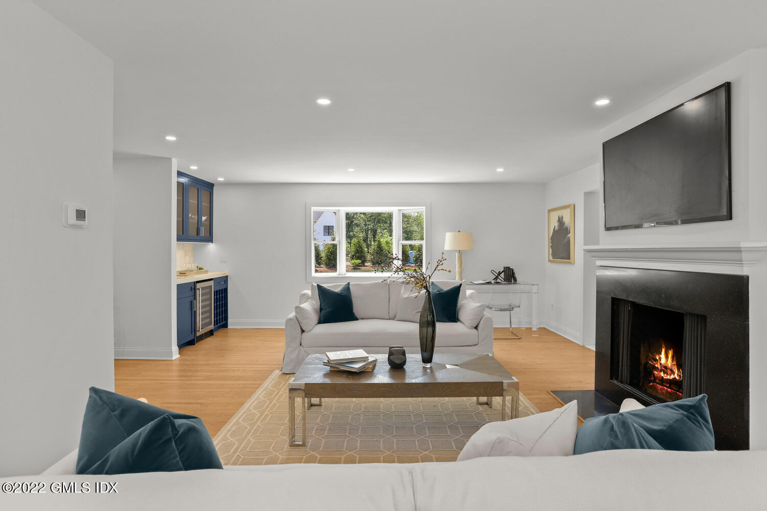 433 Stanwich Road Greenwich, CT 06830 - Photo 12 of 37 a living room with furniture and a fireplace