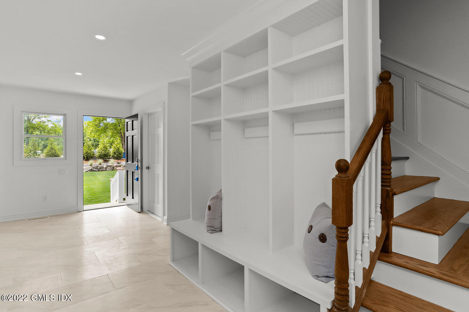433 Stanwich Road Greenwich, CT 06830 - Photo 16 of 37 a view of an entryway with wooden floor and windows