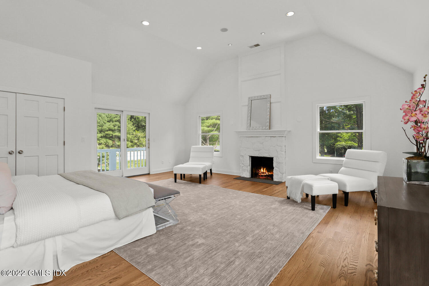 433 Stanwich Road Greenwich, CT 06830 - Photo 18 of 37 a bed room with furniture and a fireplace