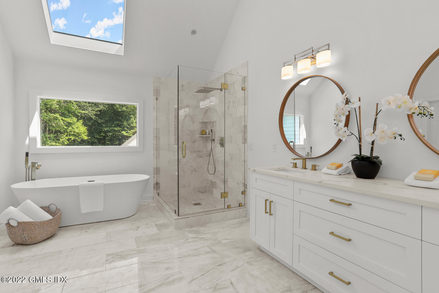433 Stanwich Road Greenwich, CT 06830 - Photo 21 of 37 a spacious bathroom with a mirror a bathtub and a sink