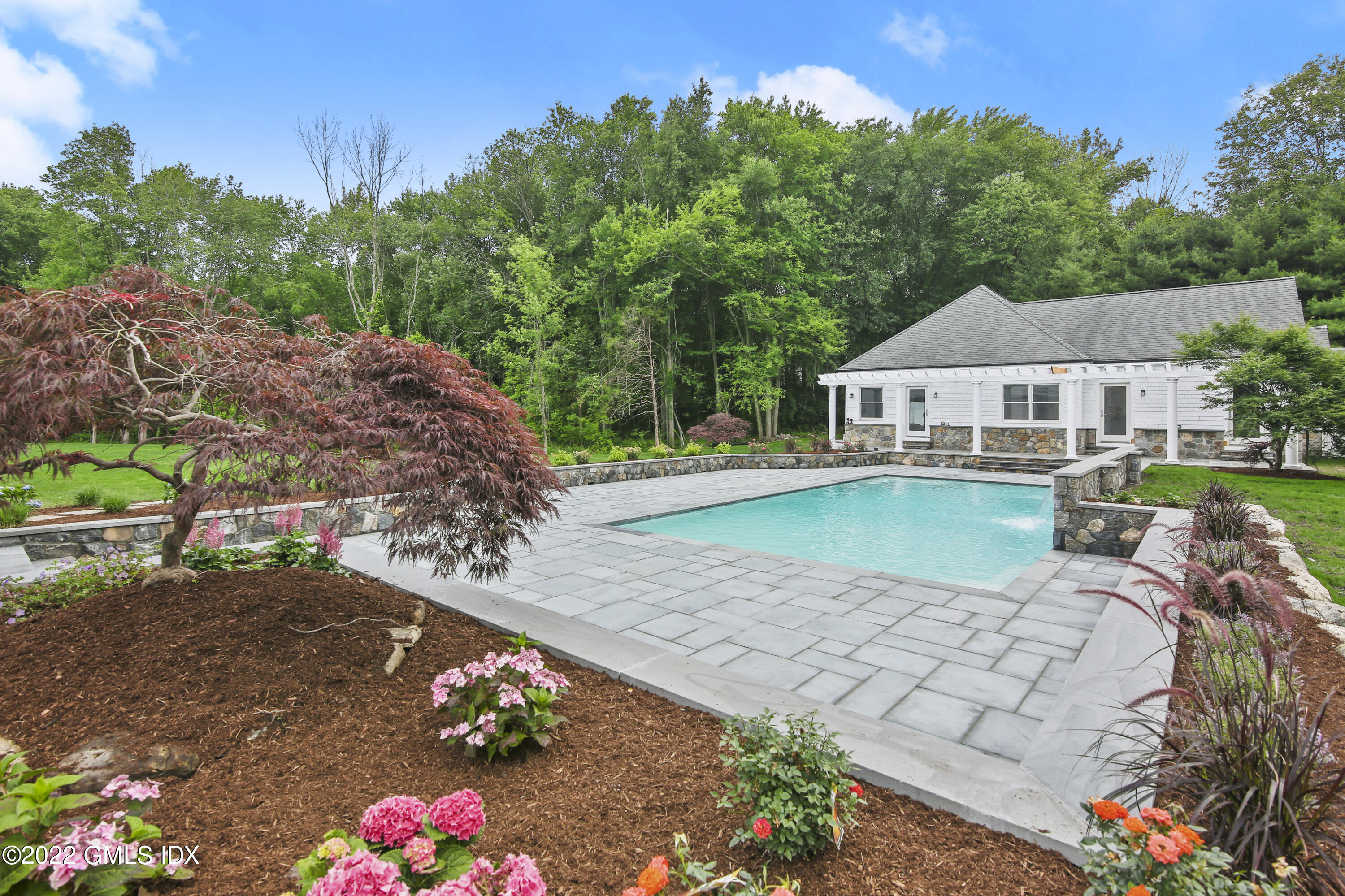 433 Stanwich Road Greenwich, CT 06830 - Photo 27 of 37 a view of a house with a yard