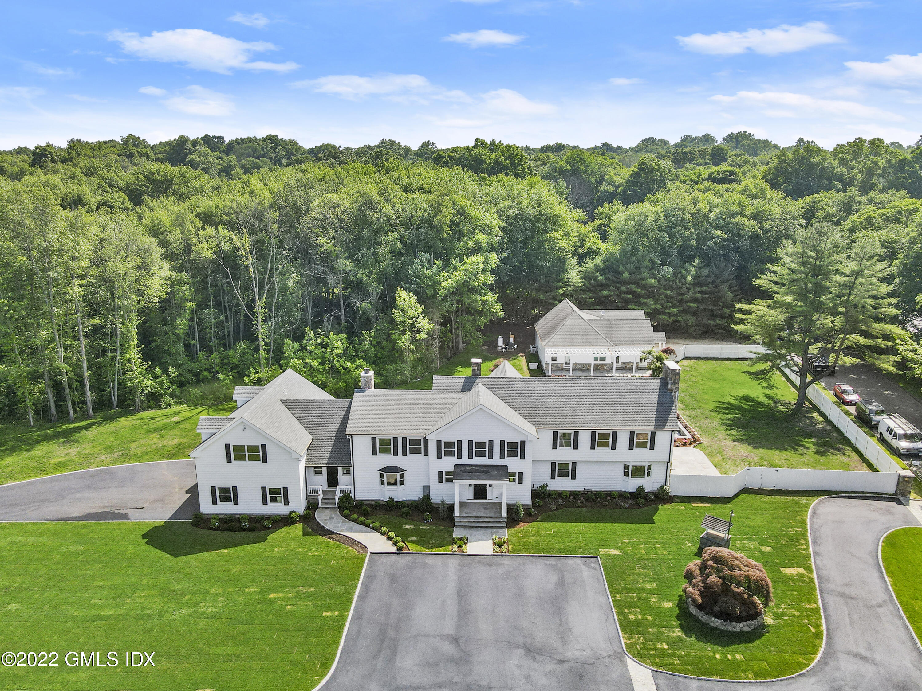 433 Stanwich Road Greenwich, CT 06830 - Photo 30 of 37 a aerial view of a house with swimming pool and garden