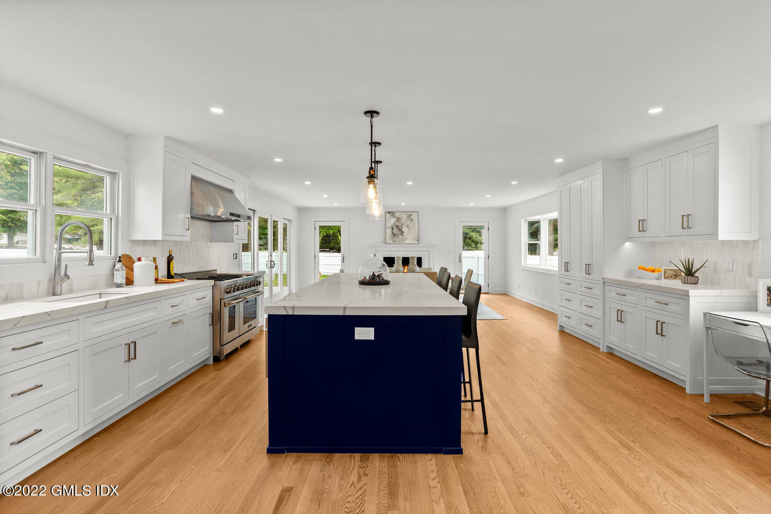 433 Stanwich Road Greenwich, CT 06830 - Photo 4 of 37 a large kitchen with stainless steel appliances kitchen island granite countertop a large counter top and wooden floors