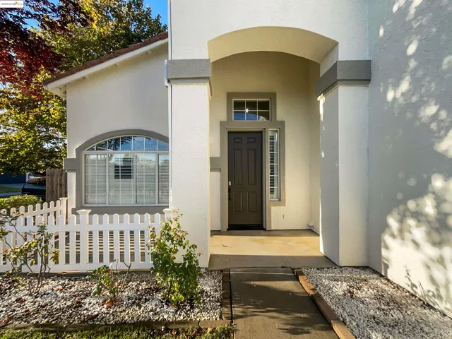 a view of a house with a tree
