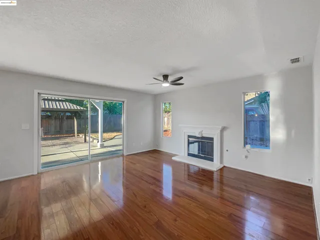 a large kitchen with cabinets a sink and stainless steel appliances