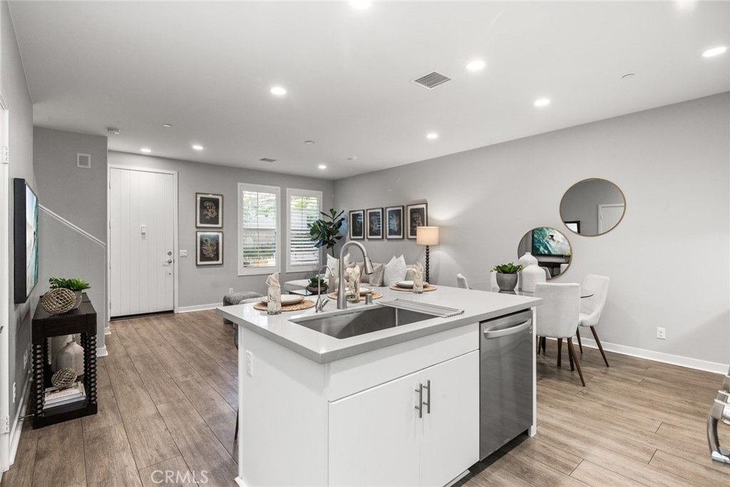 15 Jasmine Lake Forest, CA 92630 - Photo 13 of 44 a kitchen with a sink stove and wooden floor