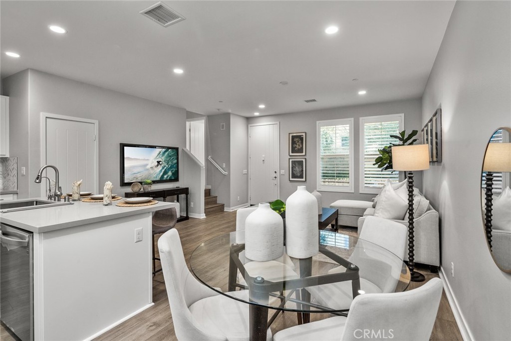 15 Jasmine Lake Forest, CA 92630 - Photo 15 of 44 a living room with furniture a flat screen tv and a table
