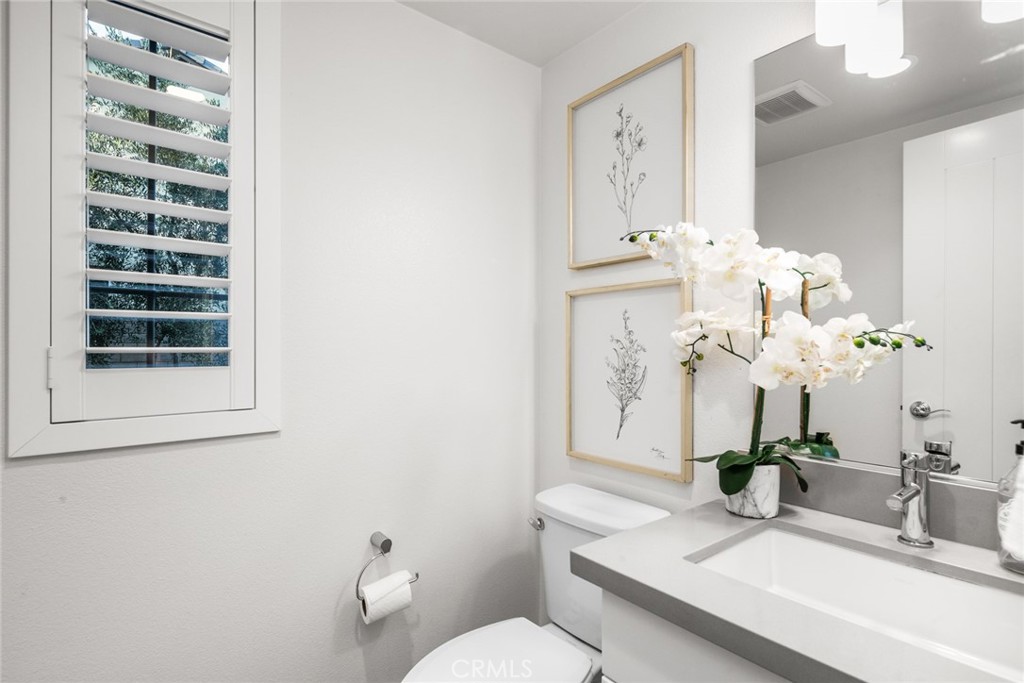 15 Jasmine Lake Forest, CA 92630 - Photo 18 of 44 a bathroom with a sink a toilet and a mirror