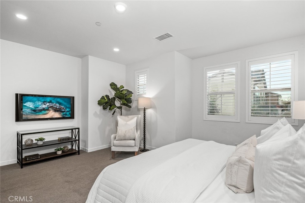 15 Jasmine Lake Forest, CA 92630 - Photo 20 of 44 a bedroom with furniture and a flat screen tv