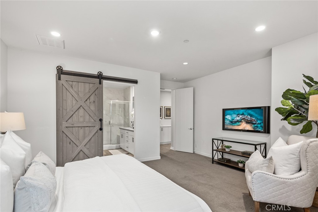 15 Jasmine Lake Forest, CA 92630 - Photo 21 of 44 a bedroom with a bed and couch