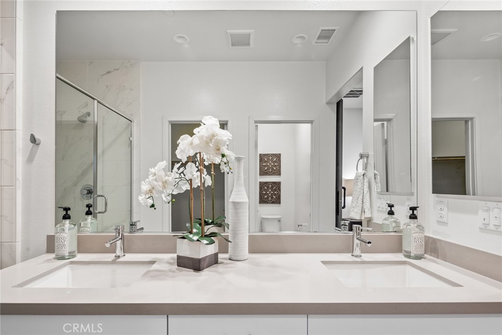 15 Jasmine Lake Forest, CA 92630 - Photo 23 of 44 a bathroom with a tub sink and mirror