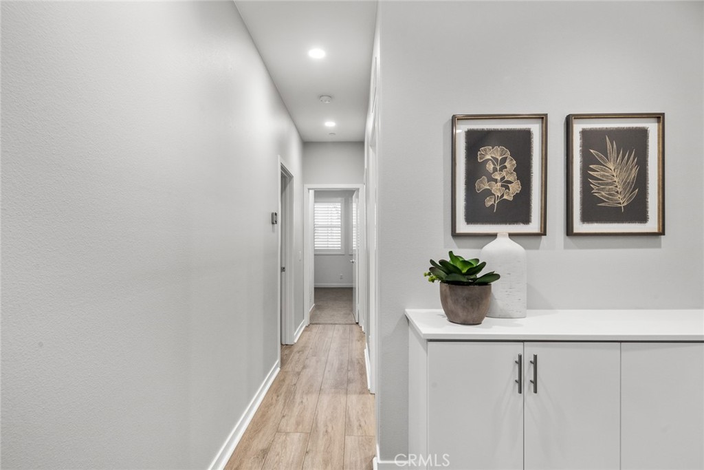 15 Jasmine Lake Forest, CA 92630 - Photo 25 of 44 a view of a hallway with wooden floor and a potted plant