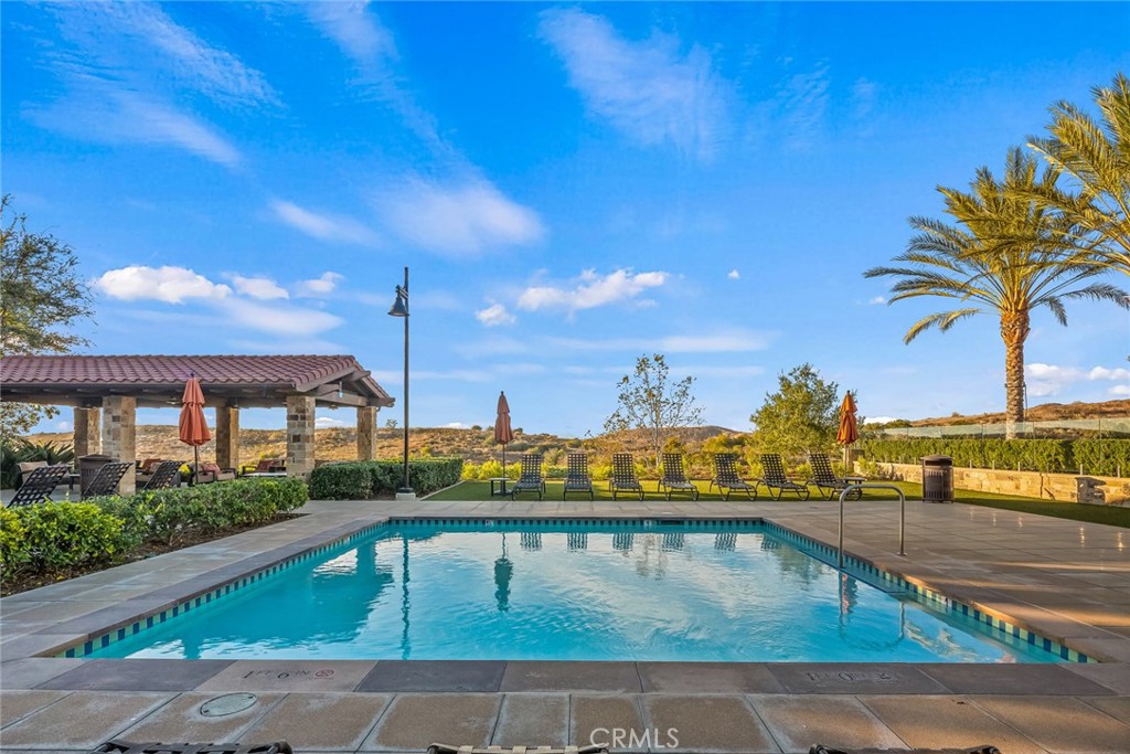 15 Jasmine Lake Forest, CA 92630 - Photo 34 of 44 a view of a swimming pool with a lounge chairs
