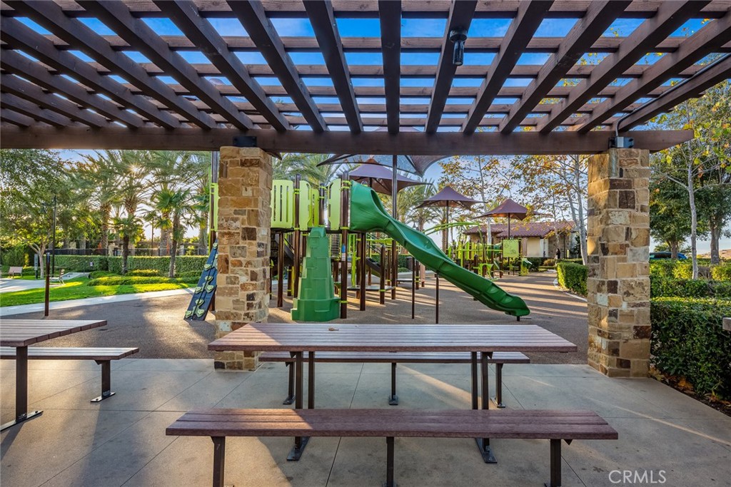 15 Jasmine Lake Forest, CA 92630 - Photo 41 of 44 a swimming pool with lawn chairs and wooden fence