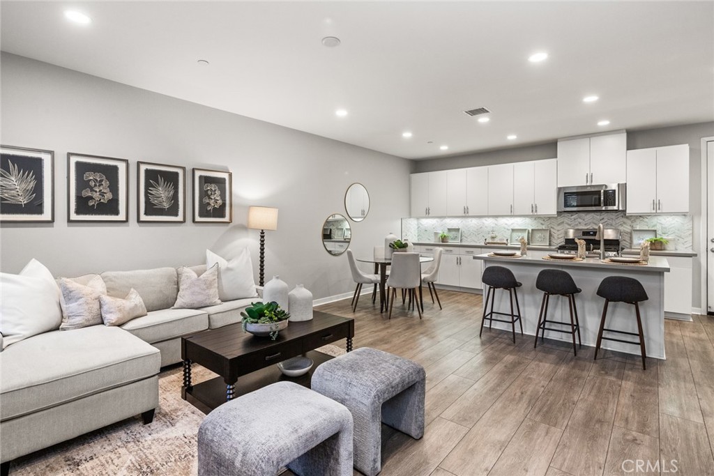 15 Jasmine Lake Forest, CA 92630 - Photo 7 of 44 a living room with furniture and kitchen view