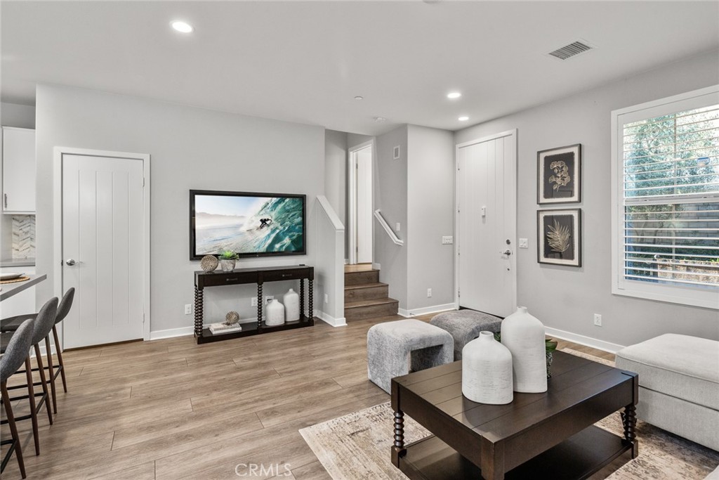 15 Jasmine Lake Forest, CA 92630 - Photo 9 of 44 a living room with furniture and a flat screen tv