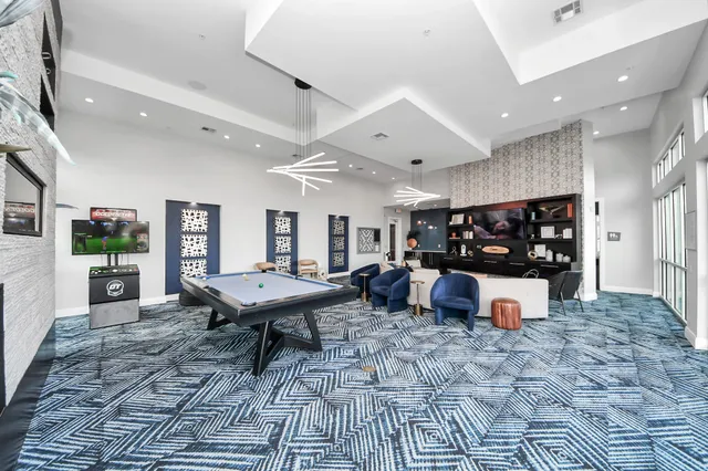 a kitchen with sink and refrigerator