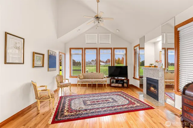 A Living Room With Furniture And Wooden Floor Homestead: Cozy Elegance Unveiled