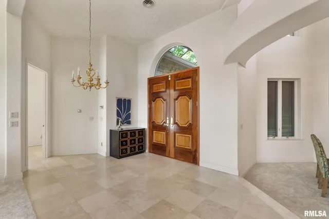 a view of living room with furniture and a potted plant