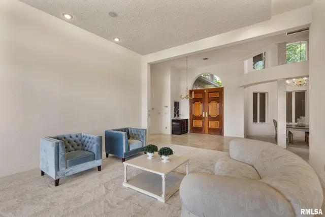 a large kitchen with a table and chairs