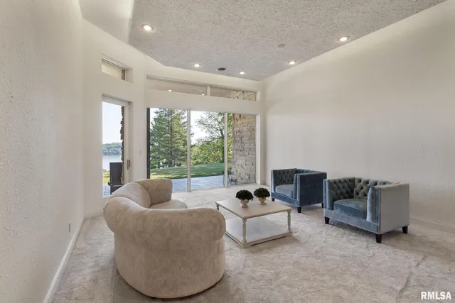 a kitchen with stainless steel appliances granite countertop a refrigerator a sink a stove and a cabinets