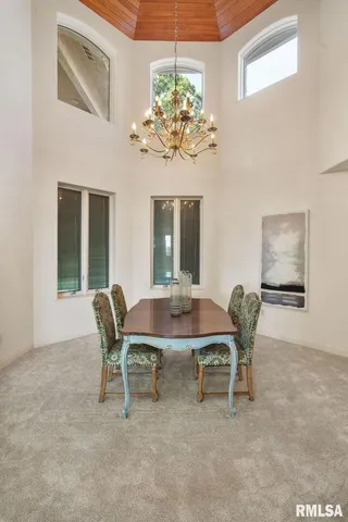 a kitchen with stainless steel appliances granite countertop a sink and a refrigerator