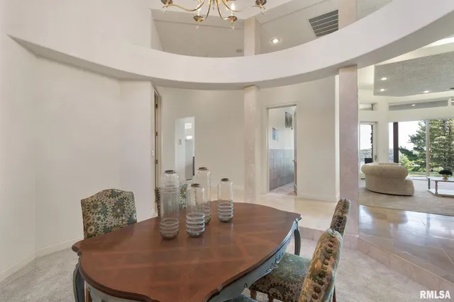 a living room with couch floor to ceiling windows and floor to ceiling window