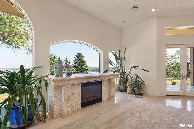 a bathroom with a sink and mirror with shower