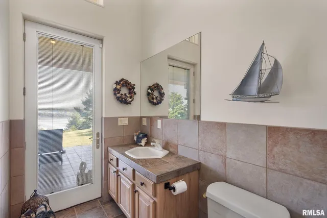 a front view of house with yard outdoor seating and green space